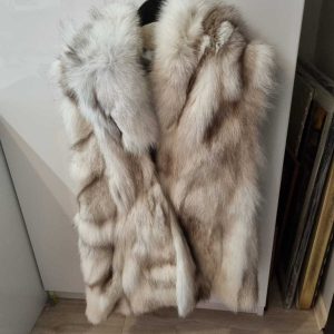 White fox vest, long hair