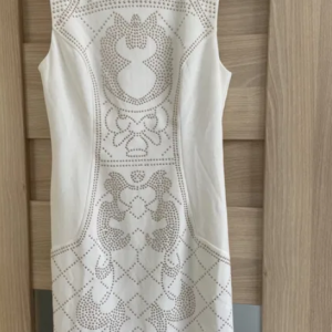 Short white dress with decoration